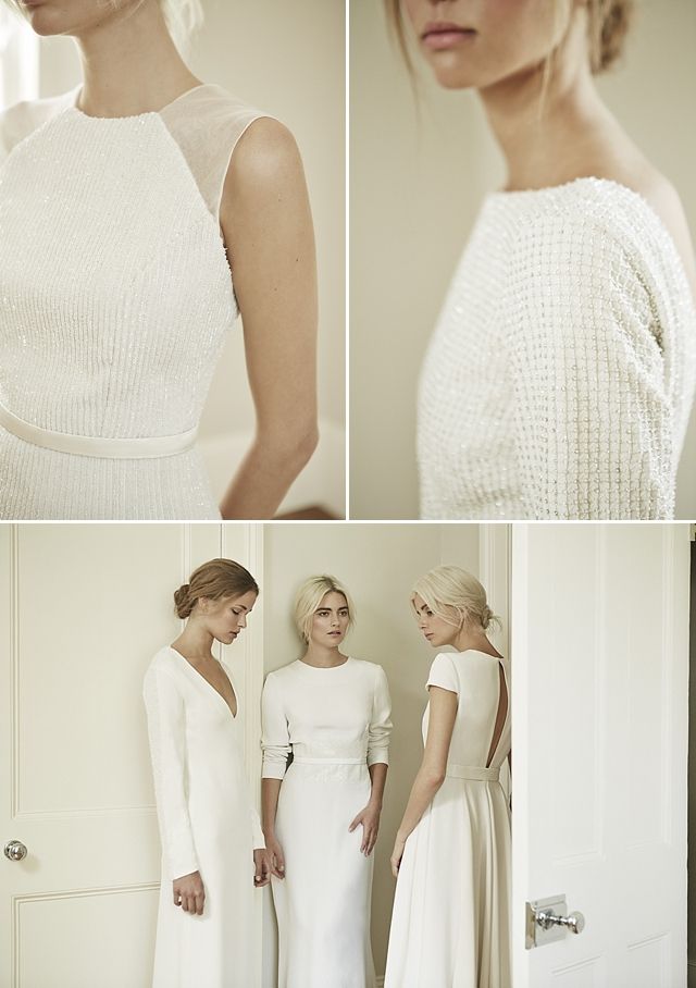 two women in white dresses standing next to each other and looking at the same person