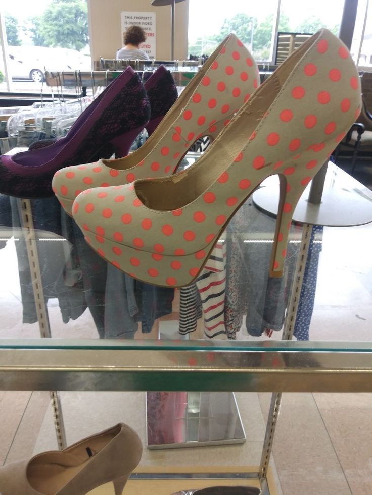 two women's shoes on display in a store