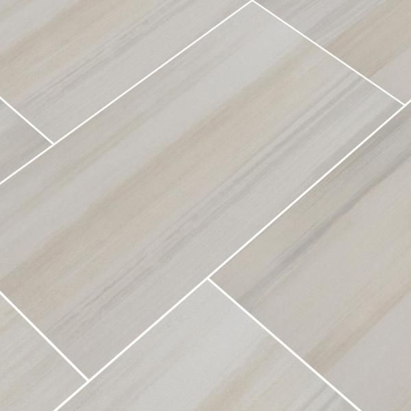 an image of a tile floor with white lines on the side and light grey tiles