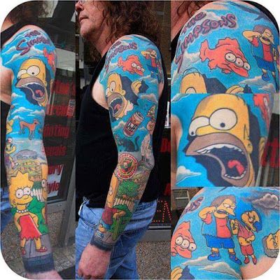 a man with his arm covered in cartoon tattoos