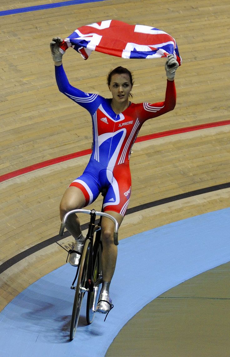 a person on a bike holding up a flag