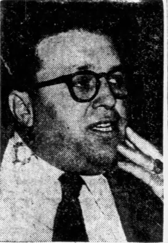 an old black and white photo of a man with glasses