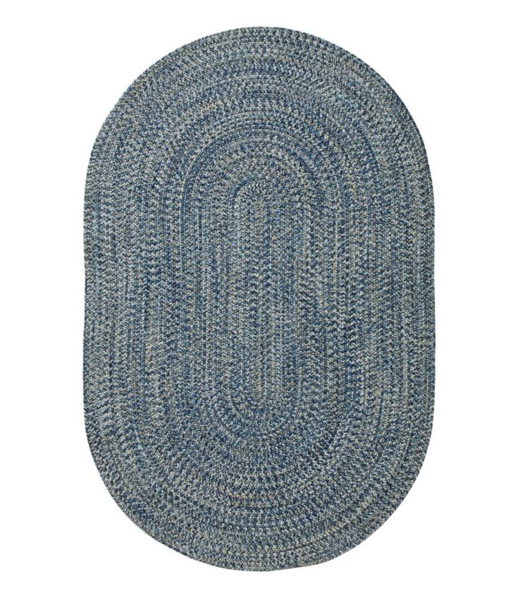 a blue oval rug on a white background