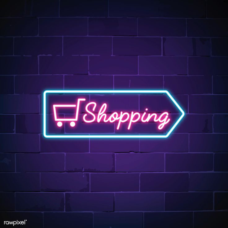 a neon sign that says i shopping on the side of a brick wall with an arrow pointing to the right