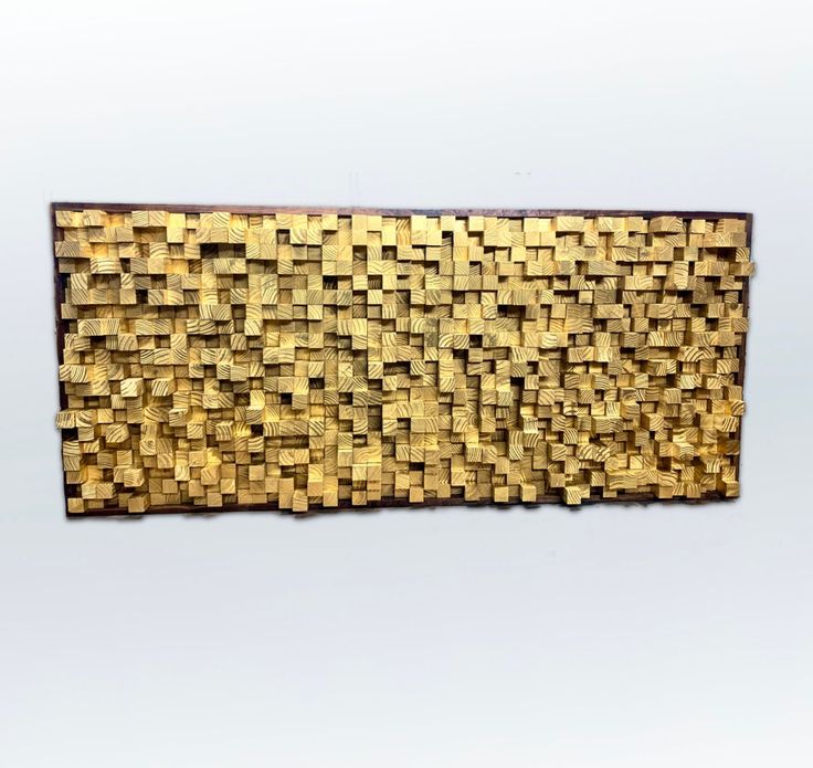 a piece of wood that has been made out of small squares and rectangles