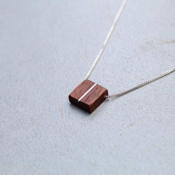 This handcrafted dainty square walnut pendant is made with a silver inlay paired with an adjustable sterling silver threader chain(16-22in) perfect for any style you choose to wear it with. Minimalist Brown Jewelry For Gift, Minimalist Brown Jewelry As A Gift, Minimalist Brown Jewelry As Gift, Minimalist Brown Necklace For Gift, Minimalist Brown Necklace For Gifts, Minimalist Brown Necklaces For Gifts, Minimalist Brown Sterling Silver Jewelry, Minimalist Brown Necklace For Everyday, Adjustable Rectangular Sterling Silver Necklace