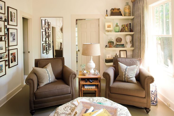 a living room with two chairs and a coffee table