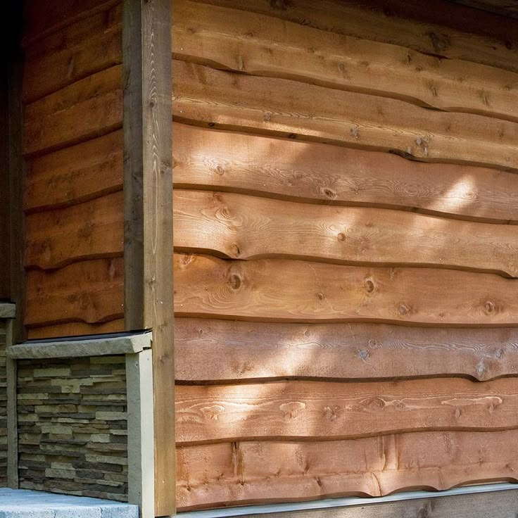 the side of a house with wood siding