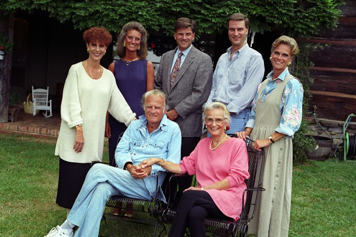 a group of people are posing for a photo