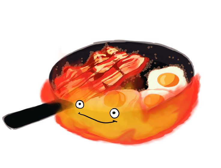 a frying pan filled with fried eggs and bacon