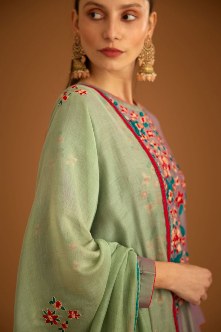 Editor's Note Featuring a thread and anchor embroidered chanderi kurta paired with embroidered dupatta and trousers Color: Grey green Fabric: Chanderi Embroidery details: Anchor and thread Kurta Length: 48", Trouser Length: 38" Components: Kurti, trouser and dupatta Occasion: Festive Care: Dry clean only About the Designer Shyam Narayan Prasad started his journey in the Indian Fashion Design Industry with a couture women’s wear collection. The designer has a womenswear label focussing on Indian Georgette Sharara, Embroidered Sharara, Sharara Set, Thread Embroidery, Grey Green, Embroidery Details, Kurti Designs, Green Fabric, Blue Fabric