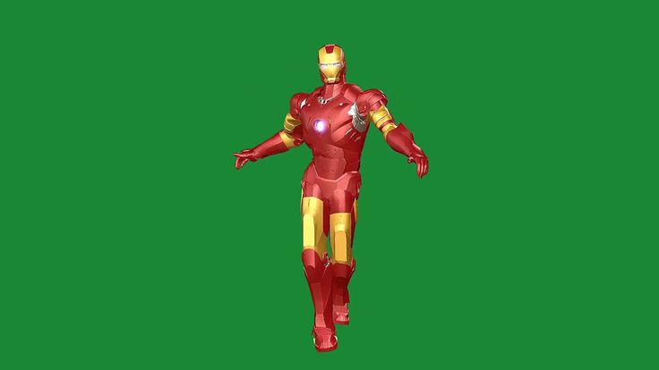 a red and yellow iron man standing in front of a green screen