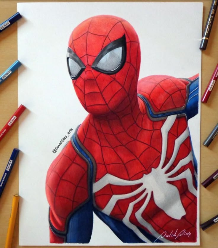 a drawing of spider - man is shown with crayons