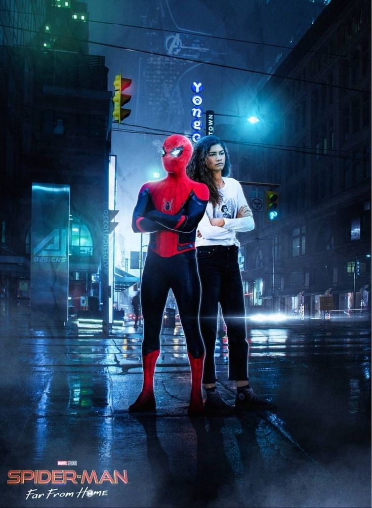 spider - man and woman standing in the street at night