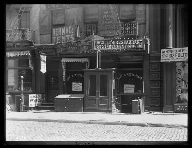 an old black and white photo of the outside of a restaurant