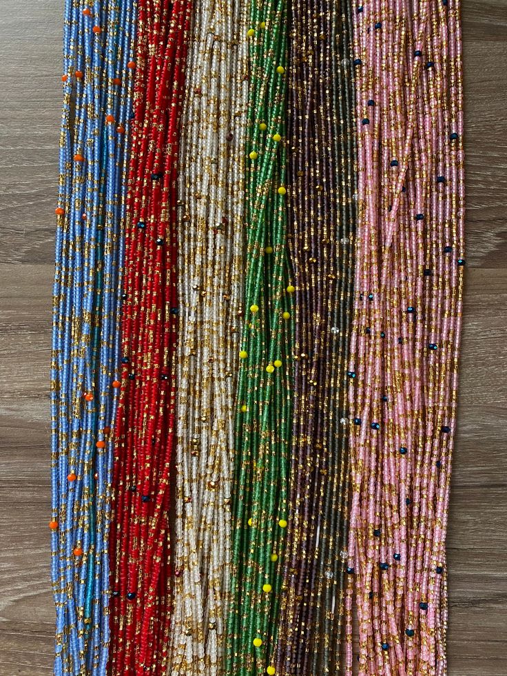 "Hey Beautiful! Welcome to SeseAdornment where you find beautiful handmade body jewelry right from Ghana. Please read carefully & message me with any questions. I'd love to be your lifetime vendor. Frost waist beads♥️♥️ ✱ Beads are made with cotton threads ✱ Lengths 40\"-50\" ✱ Bead sizes 8/0 ✱ No Returns or exchanges ✱Processing time is 3- 5 Business days ✱Ships via DHL 3-5 Business days, ✱ Dhl requires customer's phone number for shipment so please include it with your number." Multi-strand Beaded Waist Beads For Festival, Bohemian Waist Beads With Tiny Beads For Party, Bohemian Multicolor Waist Beads With Gold Beads, Colorful Waist Beads For Festivals, Colorful Heishi Waist Beads, Bohemian Heishi Beaded Waist Beads, Bohemian Tiny Beads Waist Beads For Festival, Festive Bohemian Beaded Necklaces With Tiny Beads, Festive Bohemian Beaded Necklace With Tiny Beads