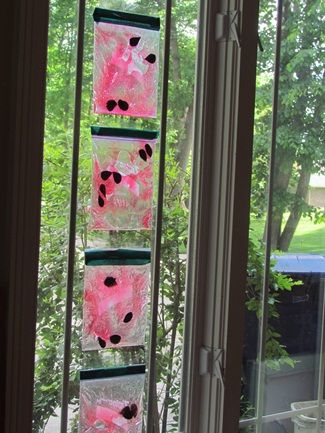 the window is decorated with pink and black decorations