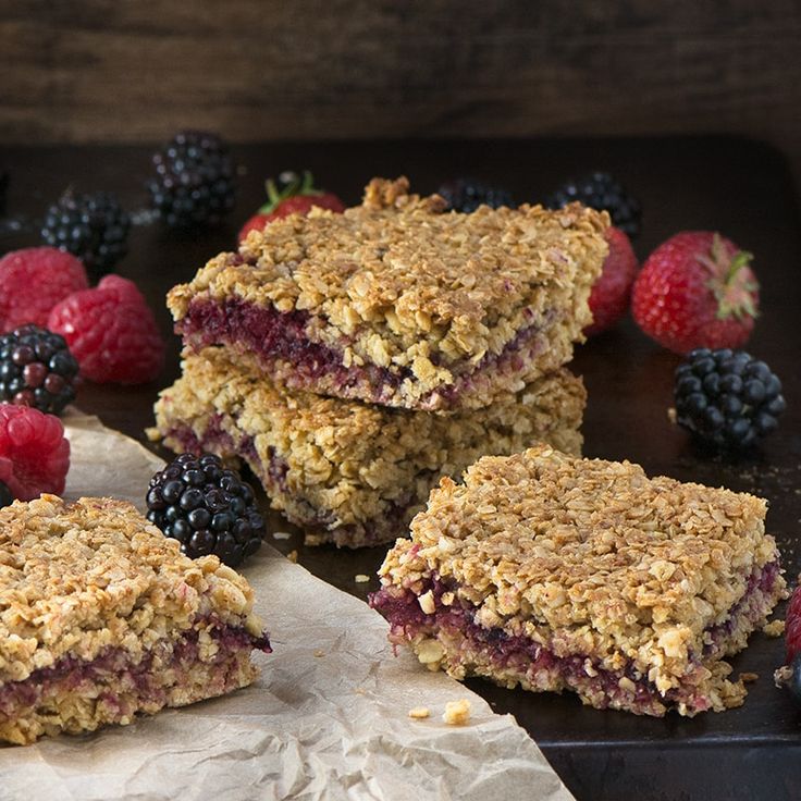 three berry crumbles are stacked on top of each other