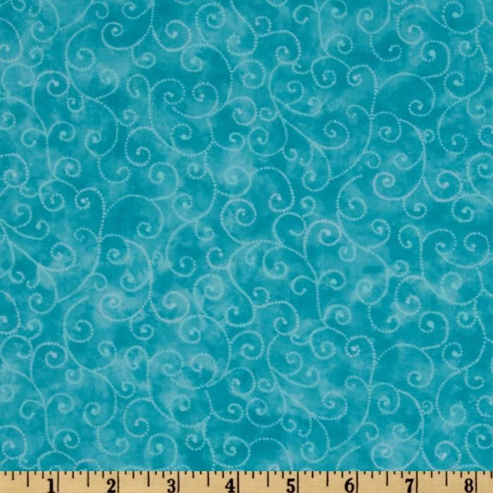 a blue fabric with swirls on it and a ruler in front of the image