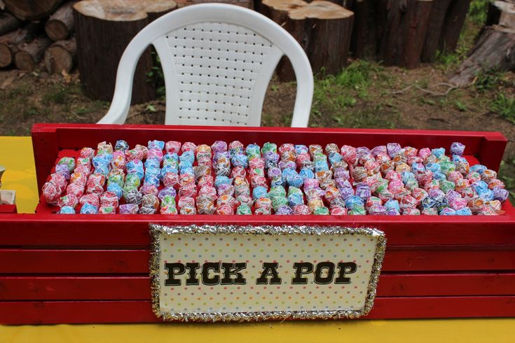 a red box filled with candy sitting on top of a table