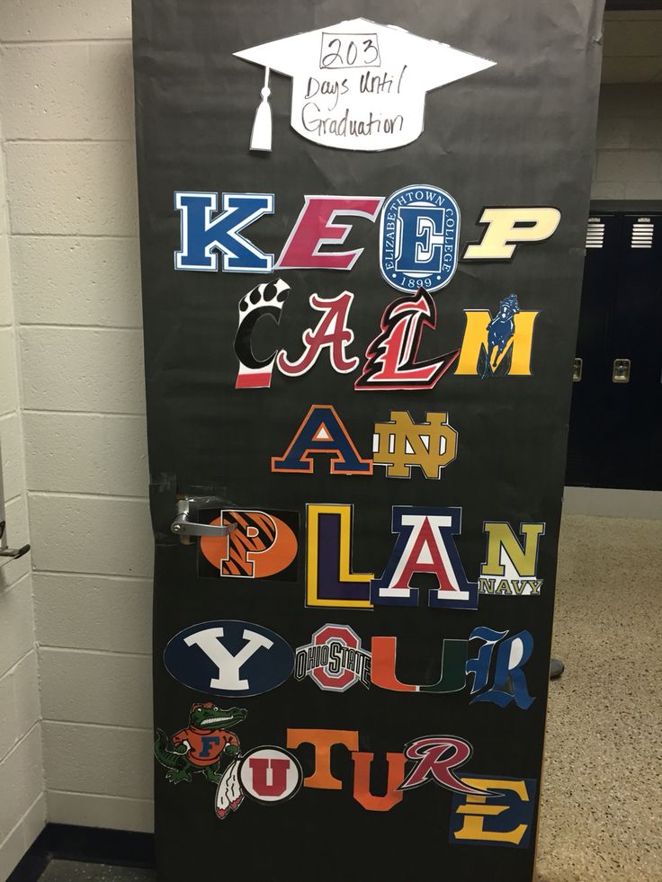 a door decorated with letters and graduation caps