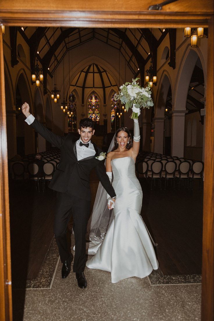 the bride and groom are walking down the aisle