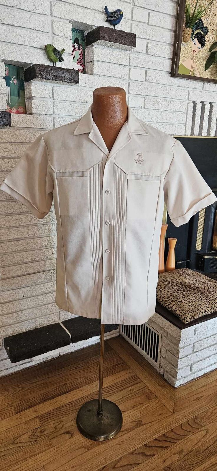 Cool 1970's Polyester ream Short sleeve Shirt! Button front, Two hidden chest pockets and a needlepoint TIKI God above left pocket! 19" across shoulders 10" sleeves 22" across chest 29" shirt Length Great condition " Iolani Hawaii Executive" Label Size Large Classic Cream Shirt With Pockets, Fitted Collared Camp Shirt With Pockets, Vintage Button-up Shirt With Patch Pockets, Fitted Beige Shirt With Pockets, Vintage Beige Top With Pockets, Vintage Button-up Camp Shirt With Pockets, Vintage Shirt With Spread Collar And Pockets, Retro Button-up Shirt With Pockets, Vintage Fitted Shirt With Pockets