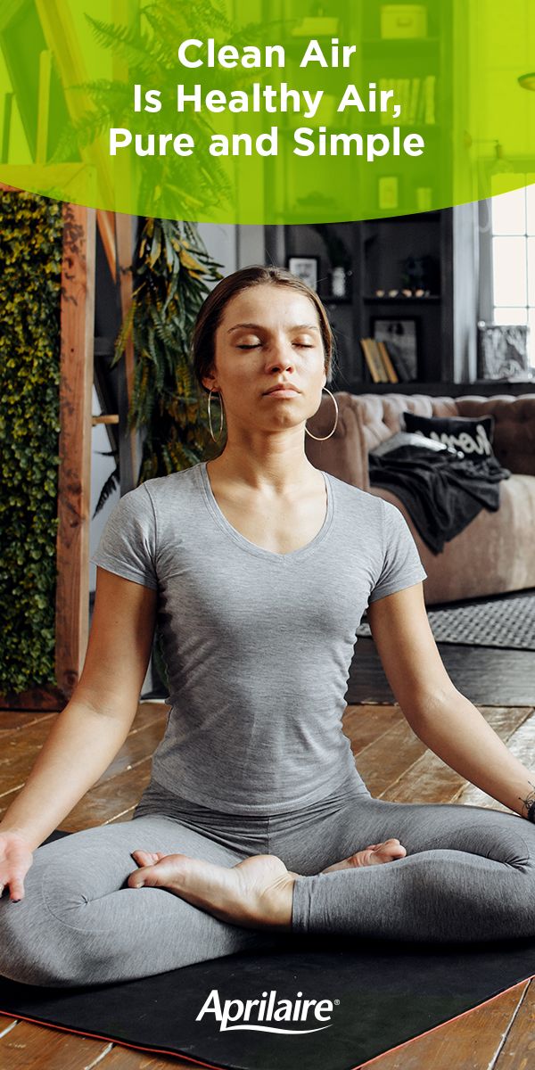 a woman sitting in a yoga pose with her eyes closed and the words clean air is healthy air, pure and simple