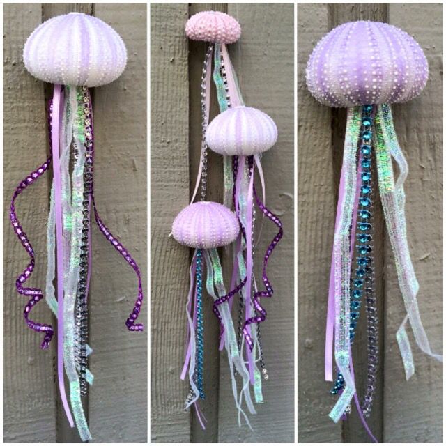 three pictures of different types of jellyfish hanging from the side of a building with beads