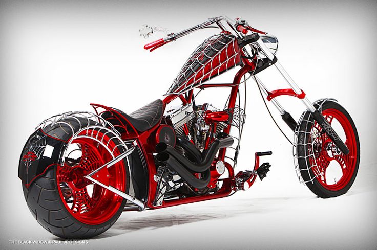 a red and black motorcycle is shown on a white background with the wheels turned down