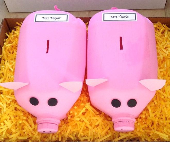 two pink pig shaped bottles in a box