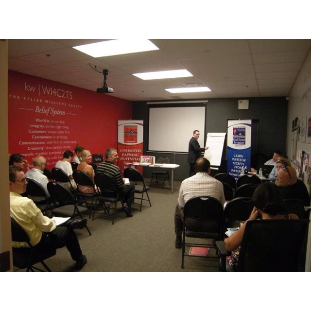 a man giving a presentation to a group of people