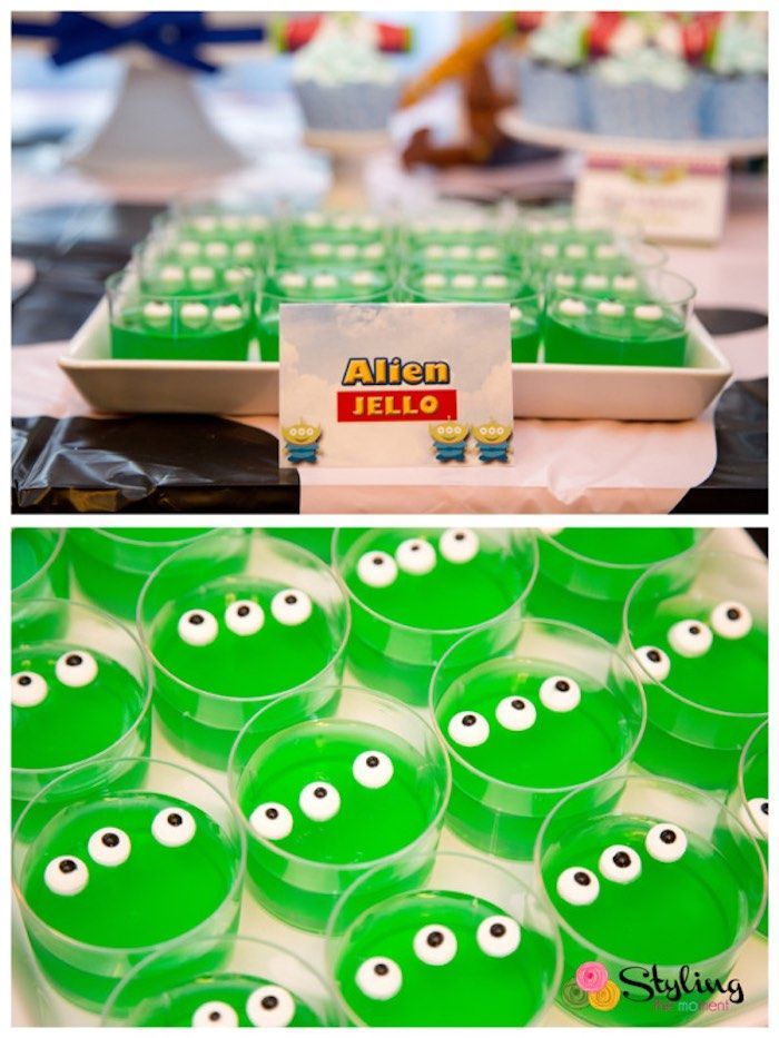 green plastic cups with googly eyes are on display at an alien themed birthday party