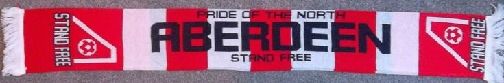 a red and white striped scarf with the words,'pride of the north'on it