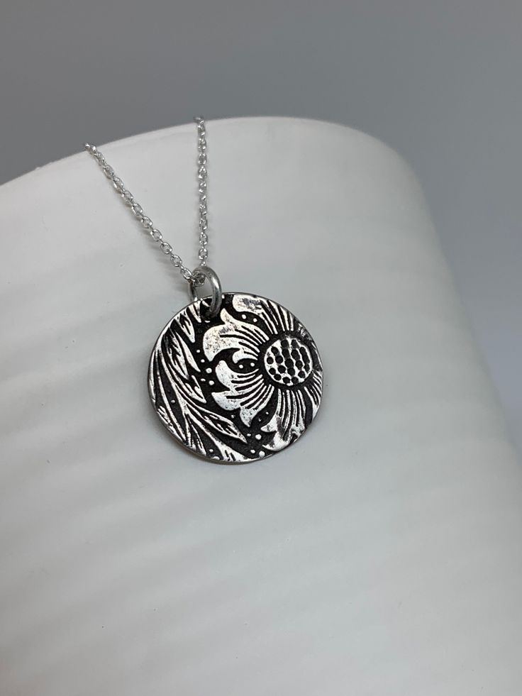 This minimalist small leafy floral necklace has been entirely handmade using .999 fine silver. It has been cut from fine silver precious metal clay, textured, fired and oxidized. The pendant hangs from a sterling silver diamond cut cable chain. This fine silver pendant features an embossed floral leaf textured pattern. Pendant size: approximately 3/4 x 3/4 inches Chain length: adjustable at 16 and 18 inches can also be customized to whatever length needed The necklace is sent in a gift box. This Layered Necklaces Boho, Moon Necklace Silver, Silver Bar Necklace, Layered Necklaces Silver, Precious Metal Clay, Charm Necklace Silver, Floral Necklace, Layering Necklace, Floral Jewellery