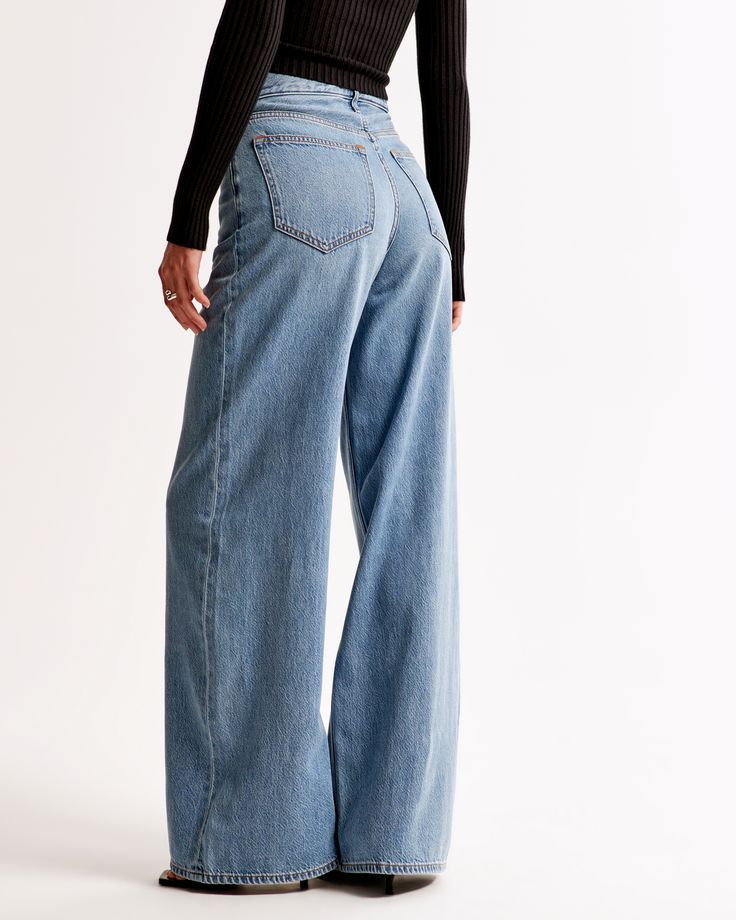 Elevate your wardrobe with the timeless elegance of Abercrombie & Fitch's Women's High Rise Wide Leg Jeans. Designed to flatter, these jeans feature a statuesque 10.5” high rise and a relaxed fit through the waist and hips, flowing into a wide, full-length leg for a striking silhouette. 

- Size: 34 SHORT
- Color: Medium Wash
- Material: Cotton, TENCEL™ Lyocell
- Gender: Female
- Age Group: Adult

Crafted from a blend of super soft, lightweight rigid denim, these jeans promise both comfort and d Chic Dark Wash Relaxed Fit Flare Jeans, Chic Relaxed Fit Dark Wash Flare Jeans, Modern High-rise Denim Bottoms, Modern High Waist Medium Wash Flare Jeans, Modern High Rise Denim Bottoms, Modern Light Wash Denim Bottoms, Modern Relaxed Fit High Rise Flare Jeans, Modern High Rise Relaxed Fit Flare Jeans, Modern Medium Wash Bottoms With Straight Hem