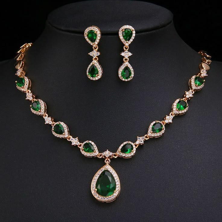 Our Emerald Green Jewelry Set makes a stunning impression. This jewelry set features an emerald green briolette necklace and dangling earrings. The gorgeous emerald green color is sure to make an amazing addition to this jewelry set. Perfect as a gift for yourself or someone you love. Premium Materials - Made from authentic gemstones & nickel-free metals Emerald Green Jewelry, Emerald Green Necklace, Bride Jewelry Set, Wedding Necklace Set, Wedding Bride Jewelry, Emerald Wedding, Crystal Jewelry Sets, Luxury Earrings, Earrings And Necklace