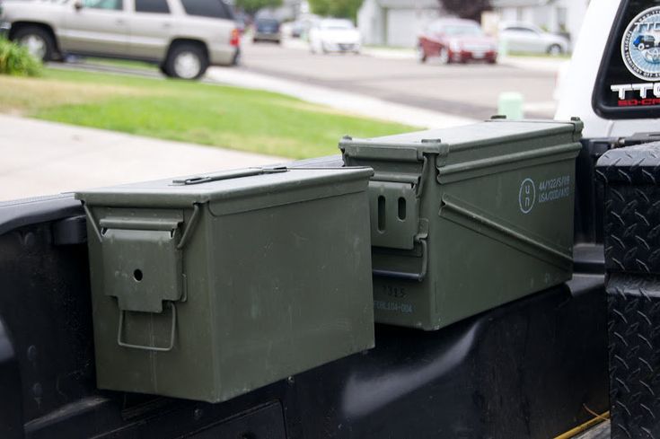 two coolers are sitting on the back of a truck