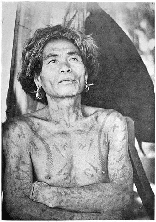 an old woman with tattoos on her chest