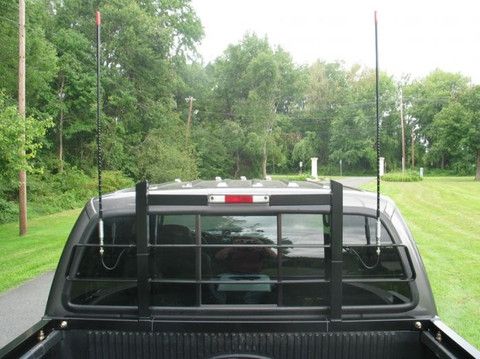 the back end of a pickup truck parked in a driveway