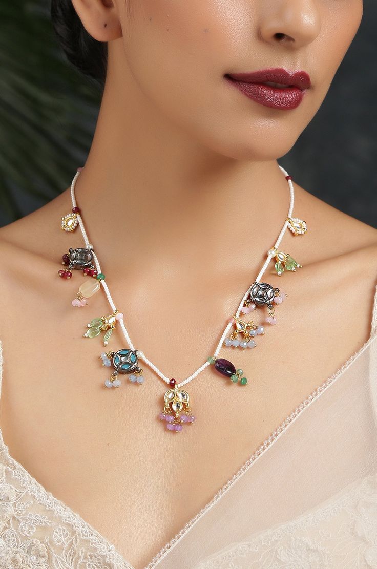 This necklace is a dainty, delightful piece. With a collection of quirky little unit, embellished with colorful stones and pearls, this necklace is perfect piece for the lovers of eccentric designs. Closure - Lobster Style Tip - Meet the perfect amalgam of poetic romance and the surrealism of fairy tales. Reminding us of clear starlit skies, magic and all the poems about love and passion, these designs are perfect for someone who wishes to add poetic details to their selections which are also re White Jeweled Kundan Necklace Gift, Bohemian Jeweled Kundan Necklace For Gift, Multicolor Jeweled Pendant Necklace, Whimsical Multicolor Wedding Jewelry, White Jeweled Necklaces For Celebration, Silver Jeweled Beaded Necklaces As Gift, Silver Jeweled Beaded Necklaces For Gift, Multicolor Jeweled Beaded Necklaces As Gift, Multicolor Jeweled Beaded Necklace For Gift