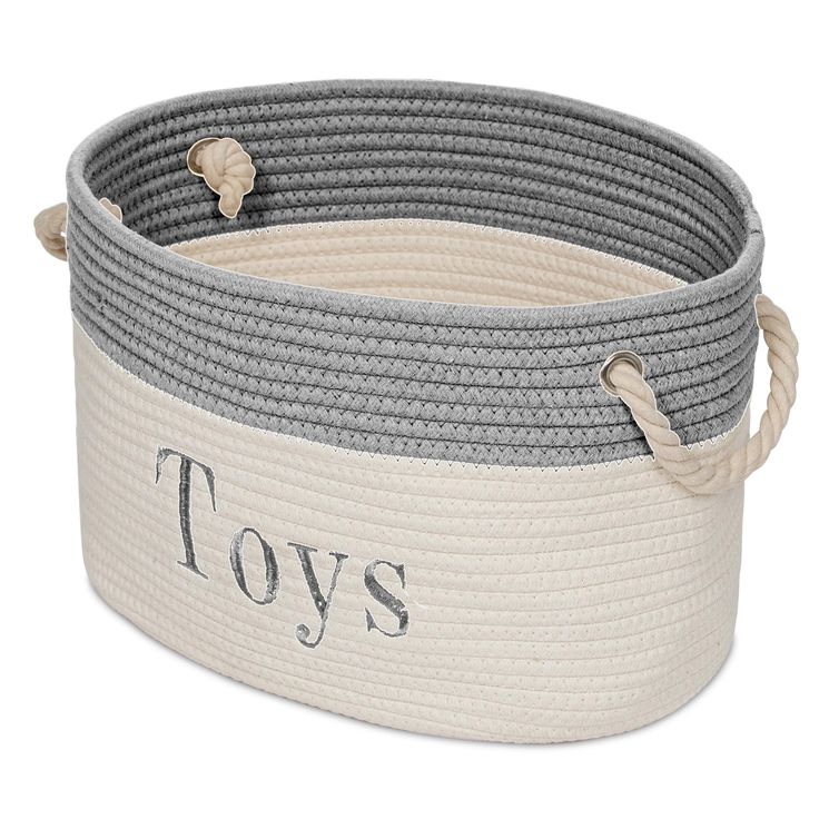 toy storage basket with rope handles and personalized wording on the bottom in grey / white