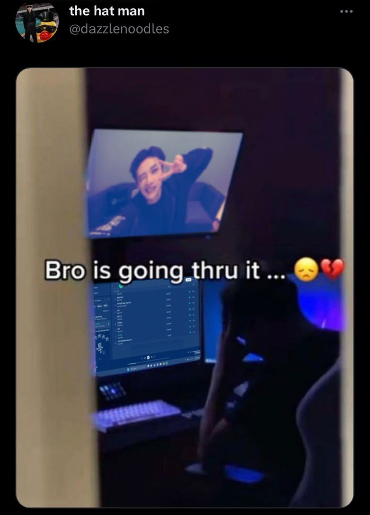 a woman sitting in front of a computer screen with the caption bro is going thru it