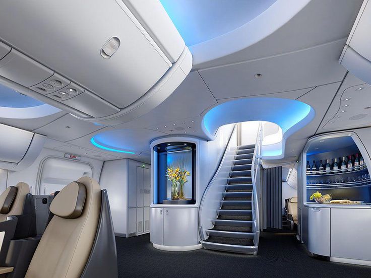 the inside of an airplane with stairs and seating