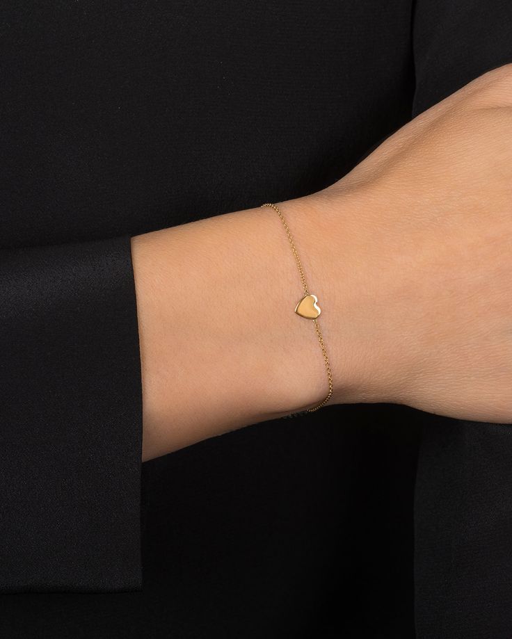 Beautifully handcrafted 14k solid gold heart bracelet, perfect solo or stacked, a fun and timeless everyday bracelet. made in L.A. Size of heart: Approx. 0.5''(H) by 0.5''(W) Comes gift ready in our beautiful branded jewelry box. 14k Gold Bracelet With Heart Charm For Everyday, Elegant Double Heart Bracelet For Everyday, Elegant Double Heart Everyday Bracelet, Elegant Everyday Double Heart Bracelet, Everyday 14k Gold Bracelet With Heart Charm, Minimalist 14k Gold Heart Bracelet For Valentine's Day, Classic Heart Cut Bracelet For Gift, Adjustable Yellow Gold Minimalist Heart Bracelet, Modern Heart Charm Jewelry For Everyday