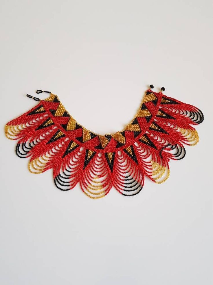 This shoulder necklace is made using colorful fine beads. Perfect for weddings, African themed events, cultural events etc. Makes a perfect gift too. **Buy multiple items and pay shipping for 1 item only.The rest ships free. More neckleces here; https://www.etsy.com/shop/TribalTess?ref=seller-platform-mcnav&section_id=21306083 Back to my shop; https://www.etsy.com/shop/TribalTess?ref=seller-platform-mcnav Handmade Choker With Round Beads For Festivals, Traditional Multicolor Beaded Necklaces As Gift, Handmade Round Beads Choker For Festivals, Traditional Colorful Beads Bib Necklace, Traditional Red Beads Choker, Beaded Necklaces For Festivals And Gifts, Beaded Necklaces For Festivals As Gifts, Festive Handmade Beaded Necklaces For Festivals, Traditional Beaded Necklaces With Dangling Round Beads