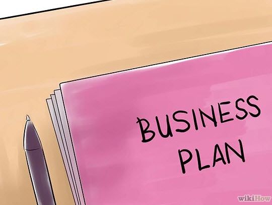 a pink sticky note with the words business plan written on it next to a pen