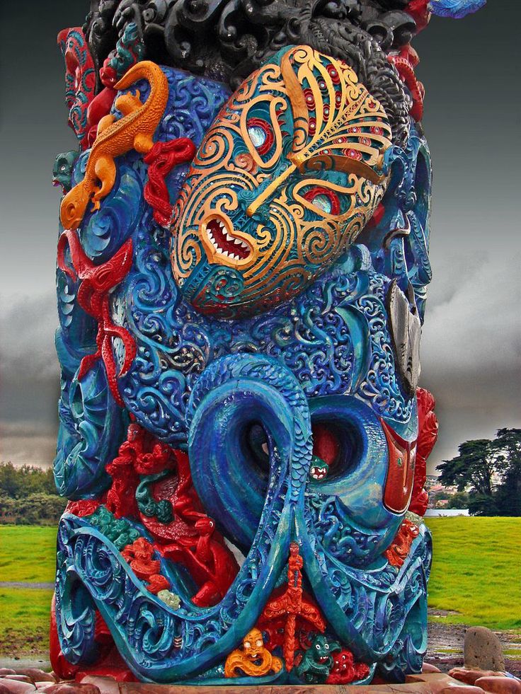 an artistic sculpture made out of blue and red material with a dragon on it's head