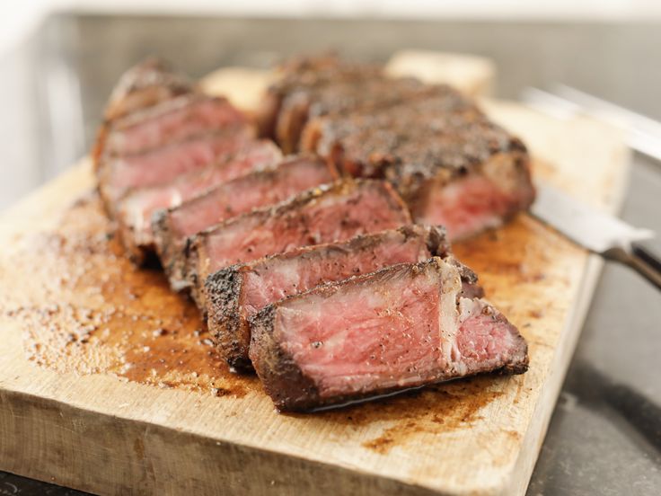 some meat is sitting on a cutting board