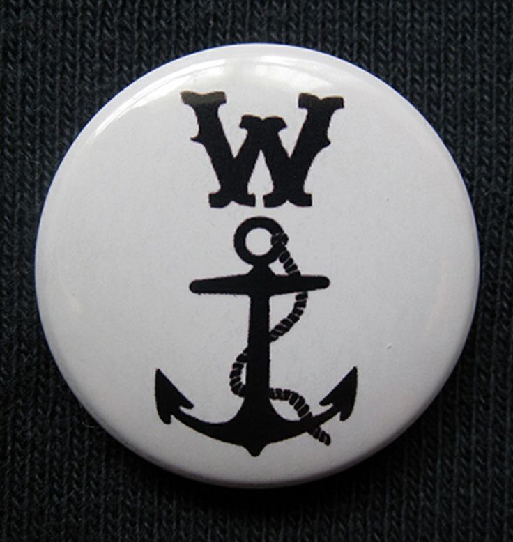 a white button with an anchor and the word w is on it's side